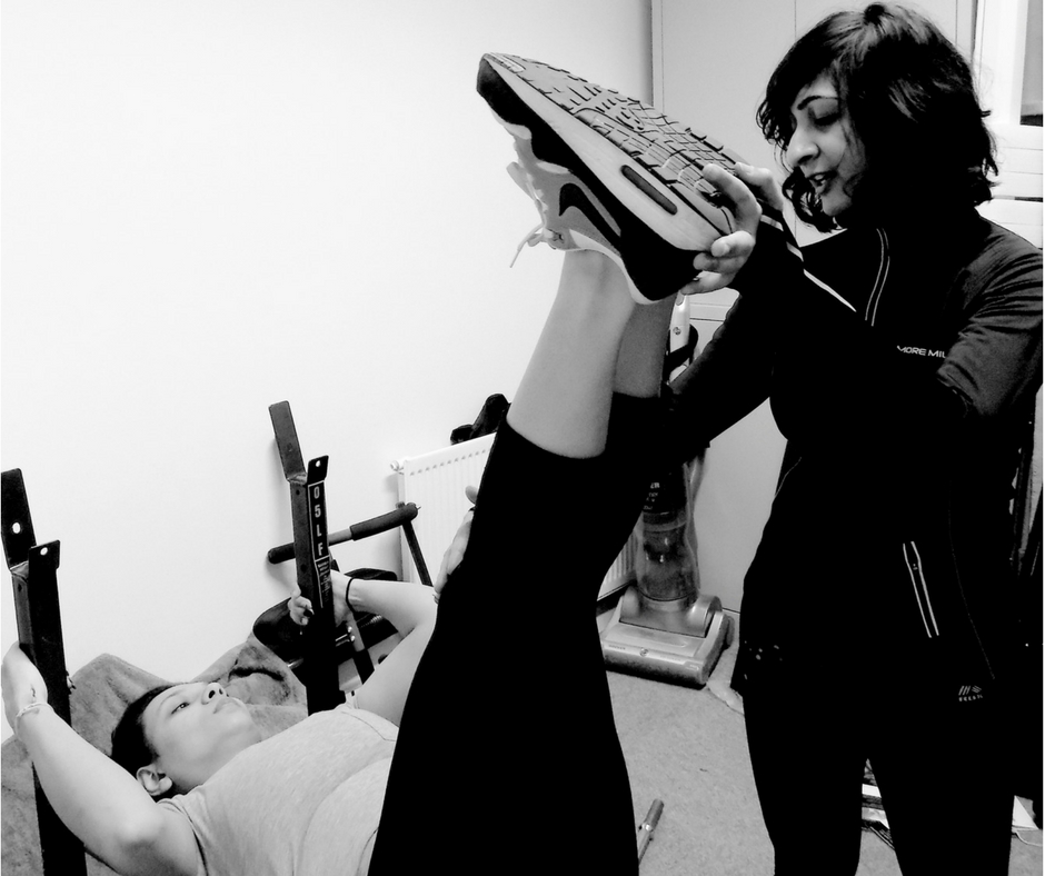 female personal trainer with client